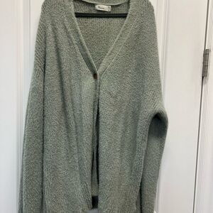 Like new! Super soft light green cardigan! Brown buttons on the front.